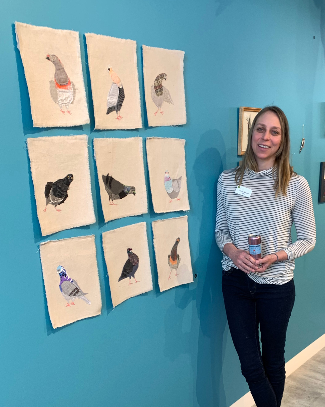 Artist Tracey Cameron poses with her piece Pigeons Group in the Alberta Craft Gallery Show Altbirda
